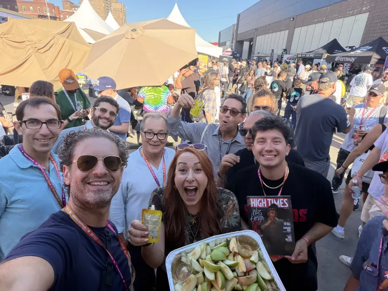 Jordan Isenstadt and friends with a tray of apple slices at Revelry