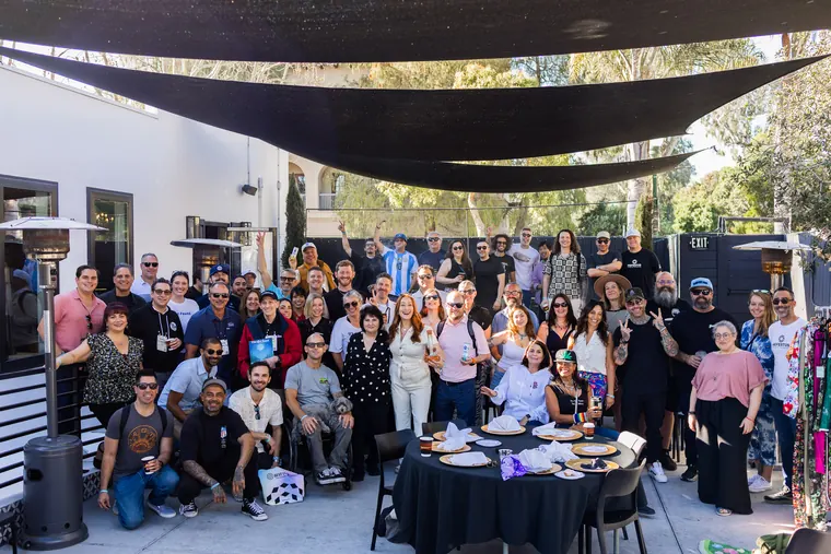 The Hall of Flowers Bagel Bash crowd gathered for a group photo in Ventura